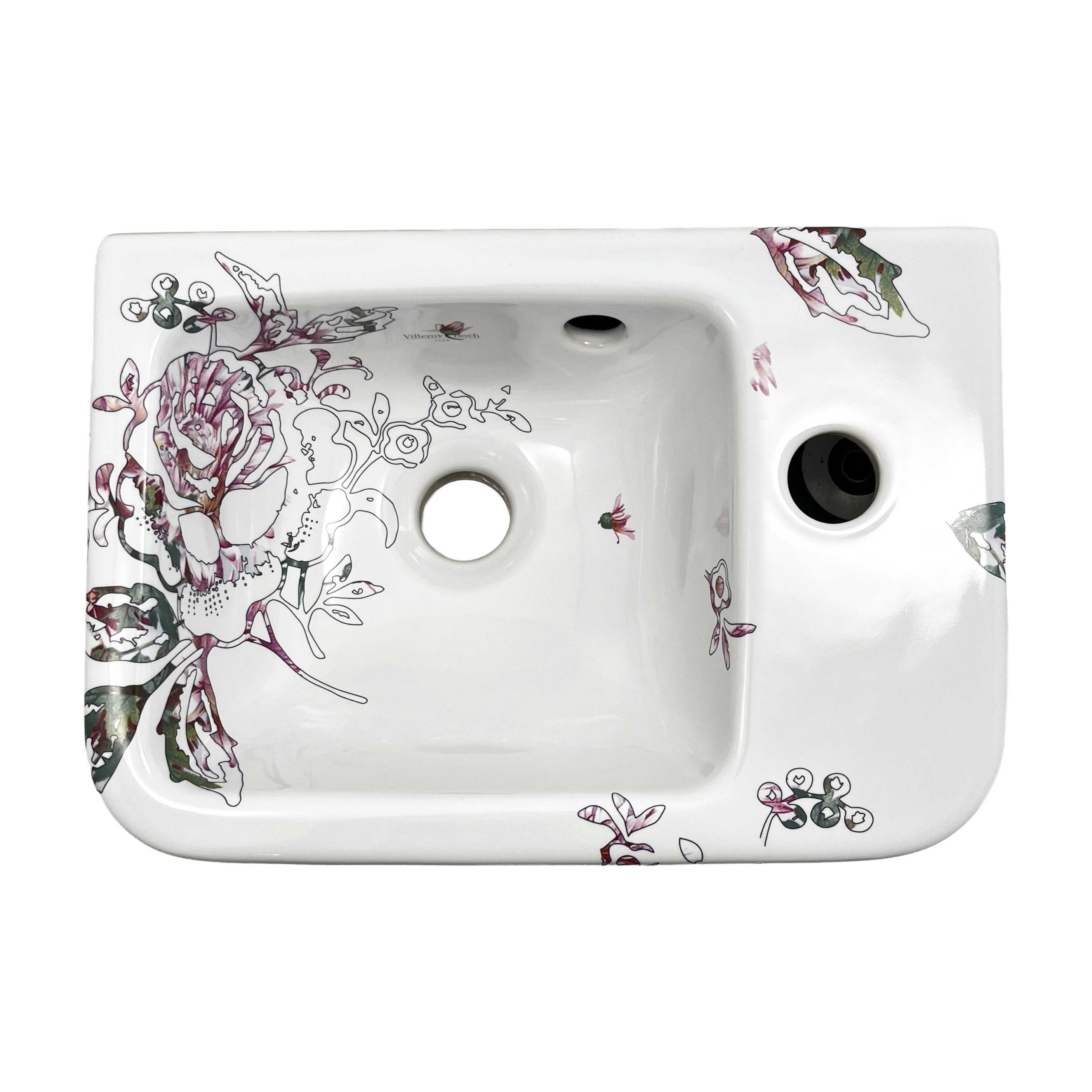 Toiletfontein met een illustratie van een roos bestaande uit fijne, zwarte lijnen, en een roze invulling. Fragmenten uit de illustratie spatten over de randen heen